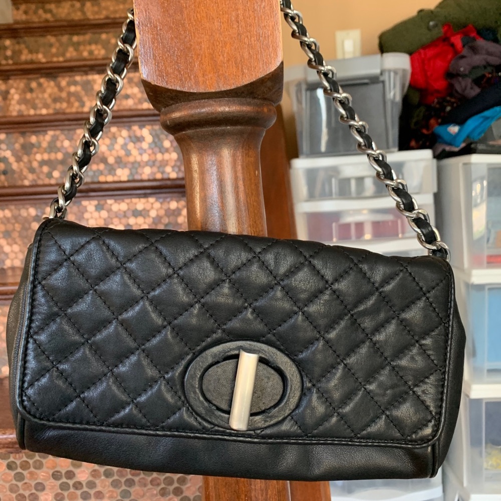 Black leather purse with a silver chain